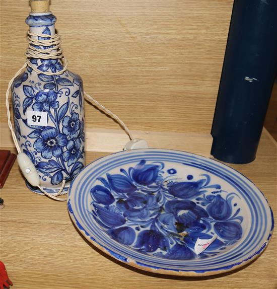 A Faience bottle, mounted as a lamp and a similar dish